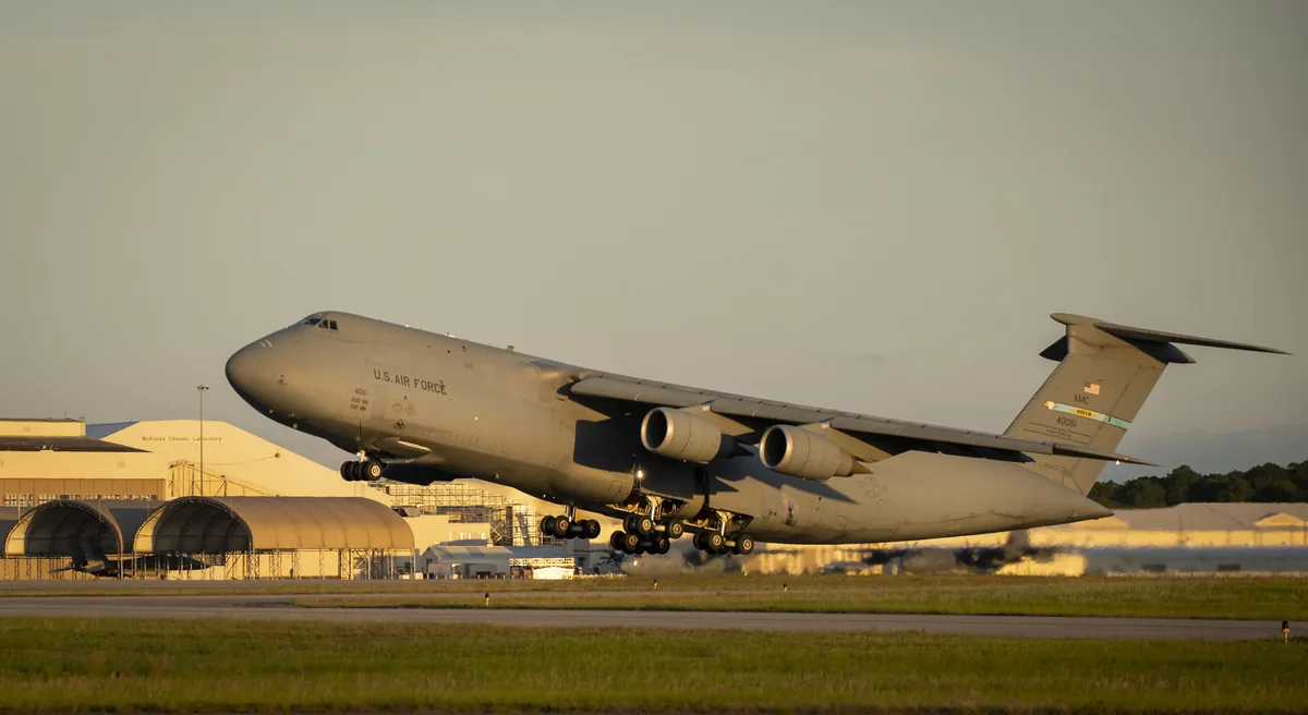 Representative Lockheed C-5M Super Galaxy lifting off from a runway in evening light.