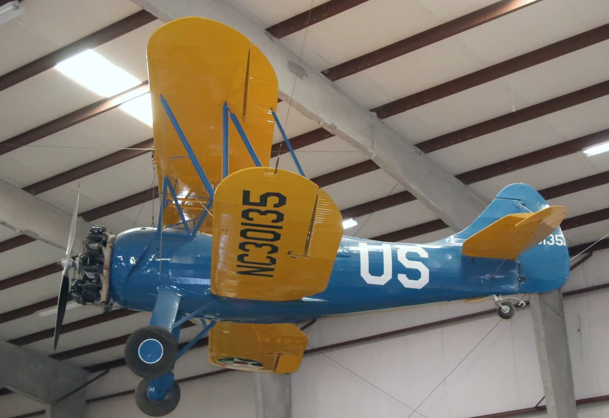 Representative Waco UPF-7 biplane displayed in a museum.